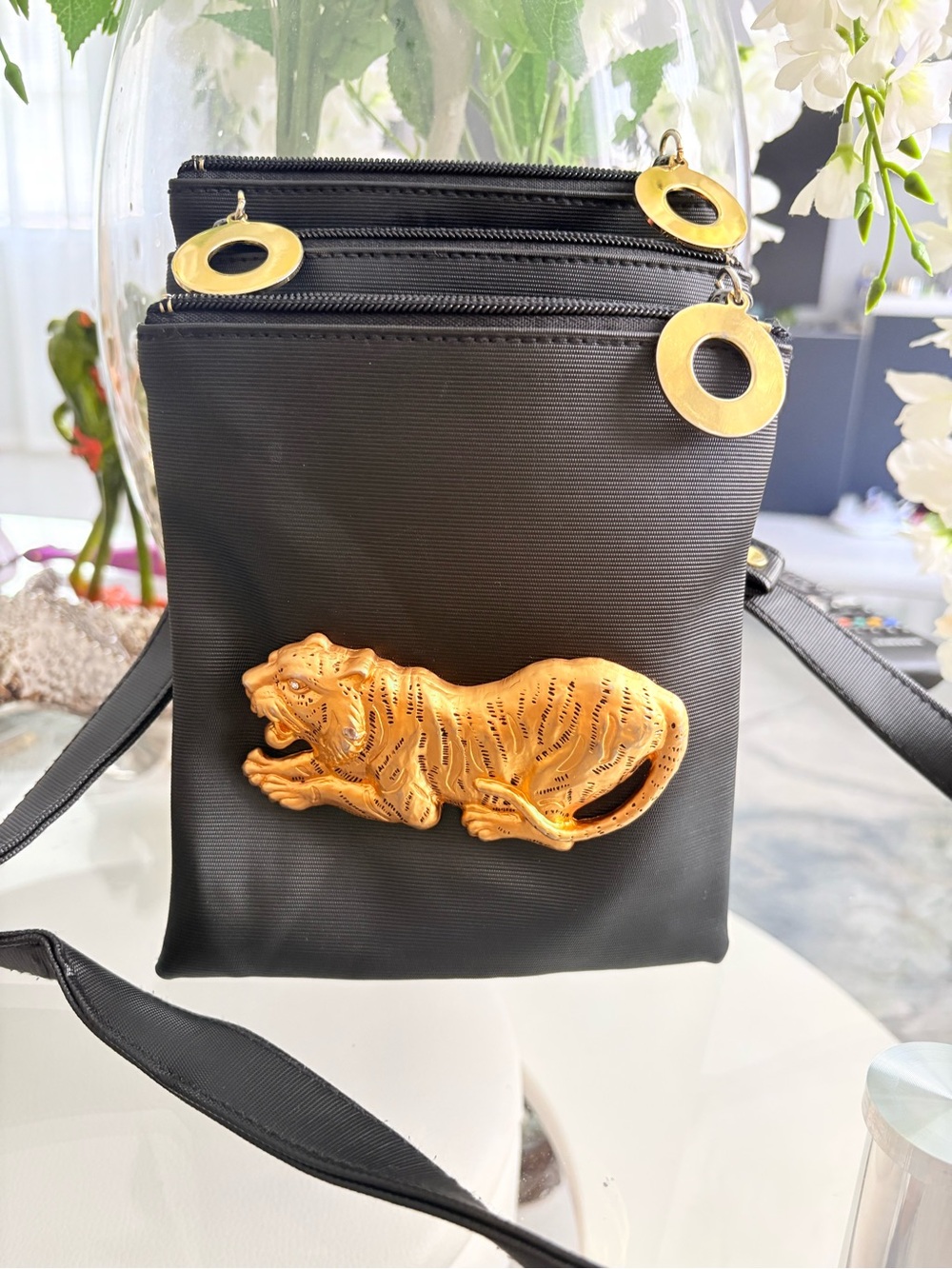 Black Crossbody Bag with Gold Tiger Accent and Ring Zippers